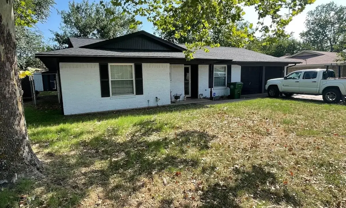 Professional roofing crew working on a residential roof in Palatine